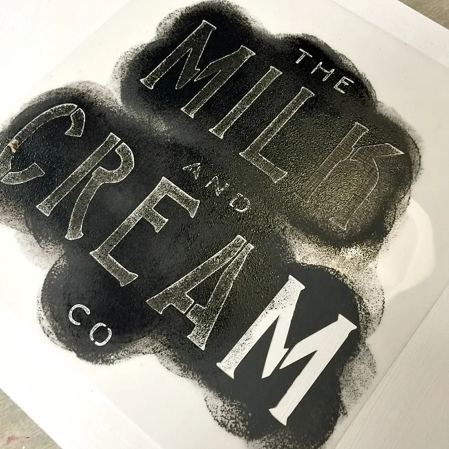 Black paint for a stenciled milk and cream tray.