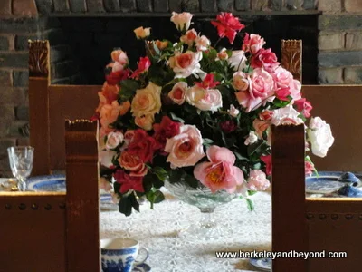 fresh roses in Bourn Cottage dining room at Empire Mine State Historic Park in Grass Valley, California