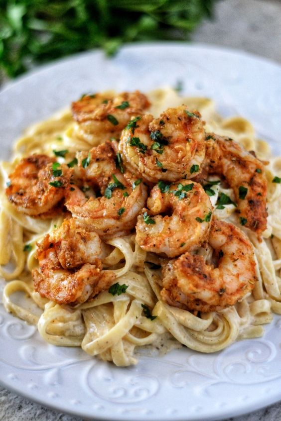 This is the easiest and BEST Fettuccine Alfredo recipe you'll ever made! Creamy, homemade Alfredo sauce with juicy, perfectly seasoned shrimp!