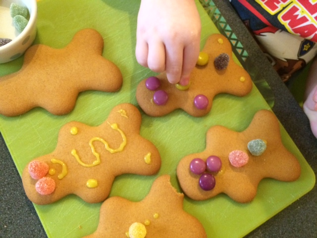 Toddler decorating gingerbread men