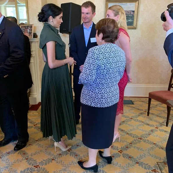 The Duchess wore a green maxi dress by US designer Brandon Maxwell. The Duchess wore Princess Diana’s gold and diamond butterfly earrings