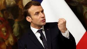 Macron vows to press through contested reform