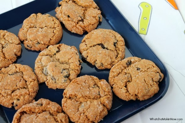 The trick to the BEST Oatmeal Raisin Cookies: Roll the dough in sugar before baking!