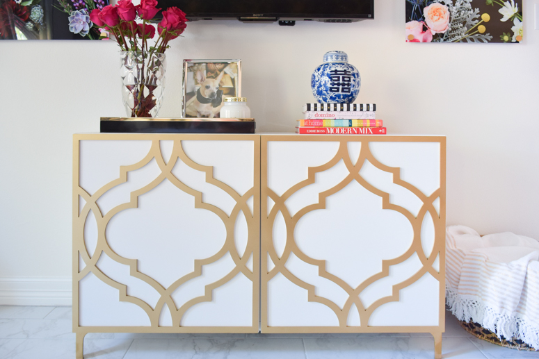An IKEA Besta TV stand with Khloe O'verlays in a master bedroom suite with black, white and gold decor touches. An IKEA Besta TV stand with Khloe O'verlays in a master bedroom suite with black, white and gold decor touches.