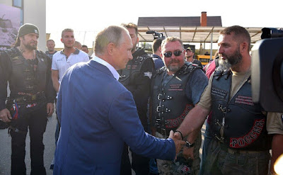 Vladimir Putin with bikers, participants of the Russian Reactor bike show.