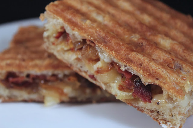 Caramelized onion, bacon, and cheddar panini on seeded focaccia