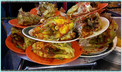 kari kepala ikan - bersusun kepala ikan tunggu untuk dimakan