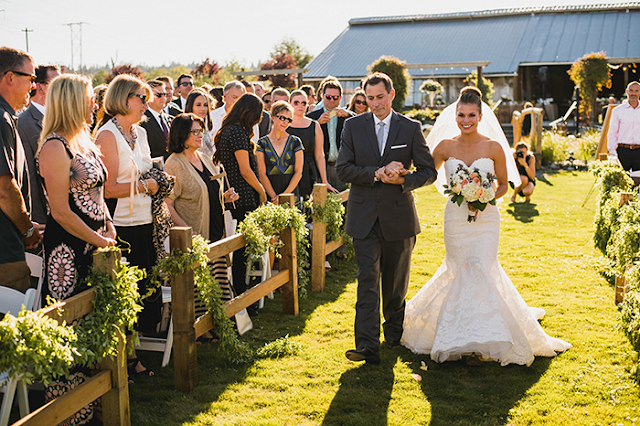 Walking down the aisle on the farm lawn father daughter walk