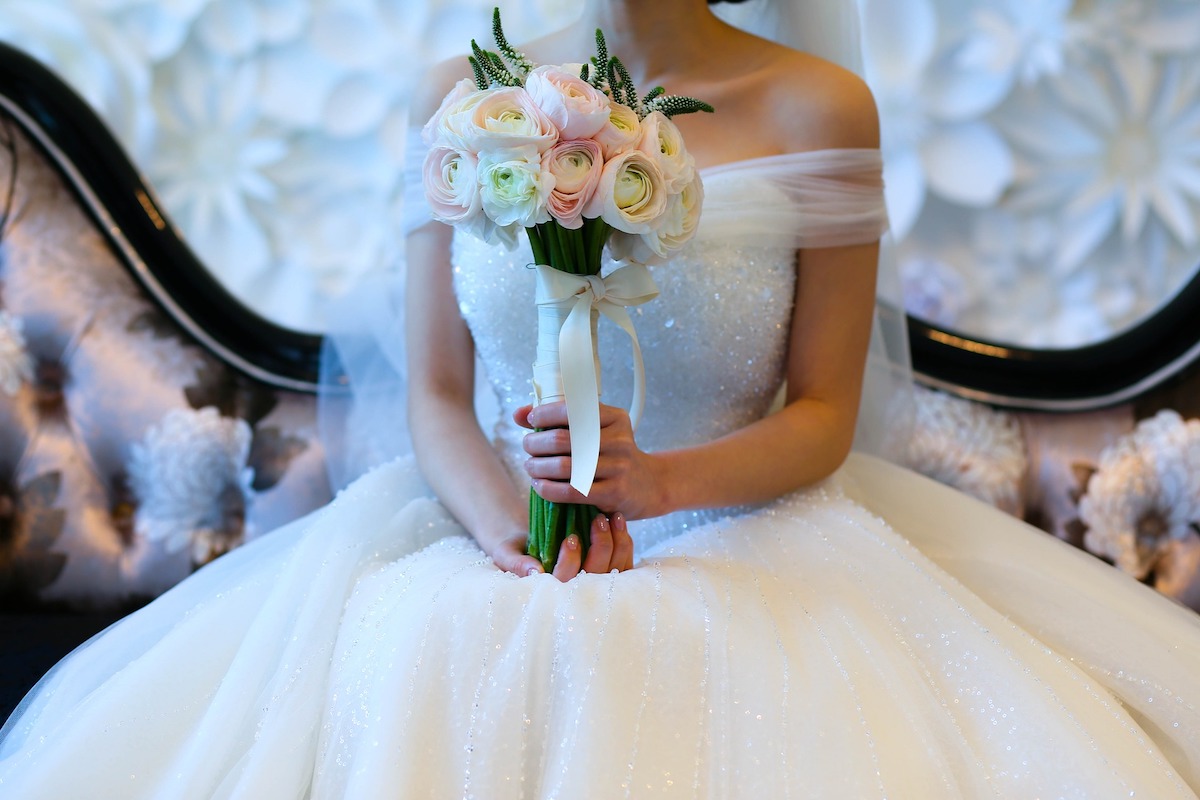 The real reason why brides carry bouquets