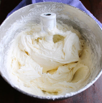 mixing bowl full of white marshmallow buttercream frosting