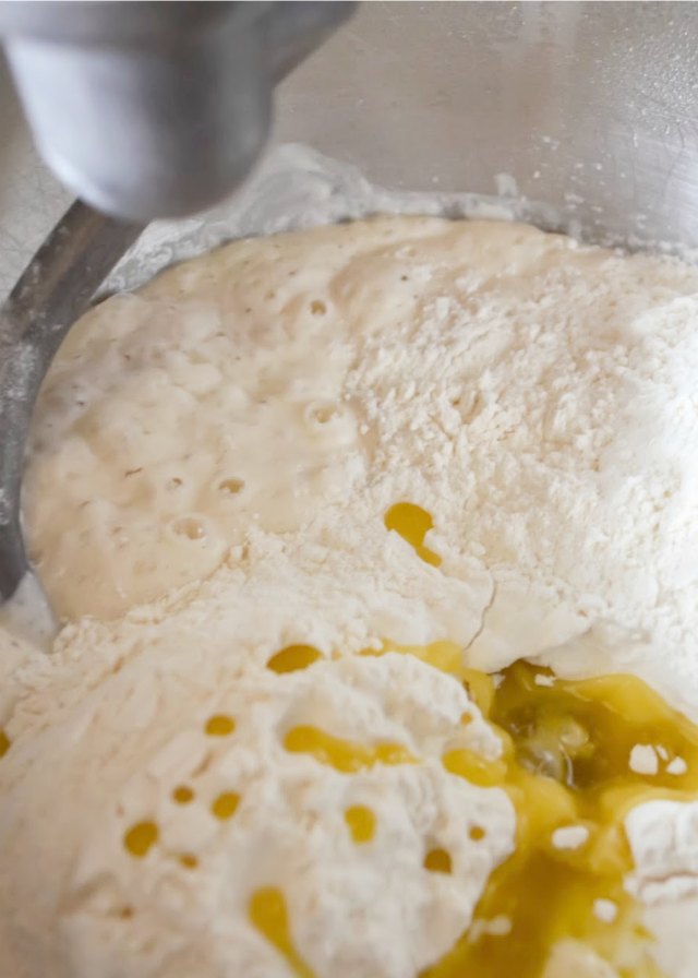 Herb Focaccia Bread recipe stir in flour and olive oil from Serena Bakes Simply From Scratch.