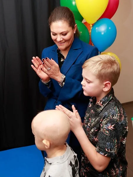 Crown Princess Victoria's Children and Youth Hospital. Erdem x H&M floral blouse Af Klingberg boots, Valentino shoulder bag