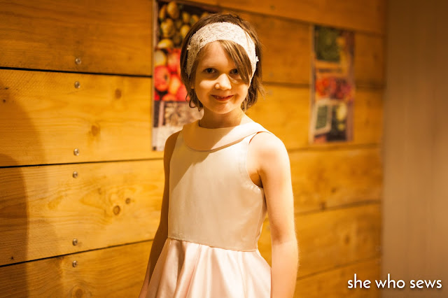 Smiling girl close up of party dress Silver silk bodice dress