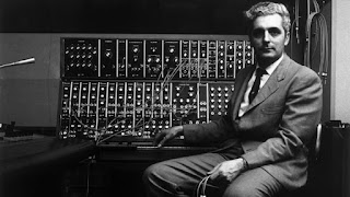 American inventor Robert Moog smiling as he rests his arms atop his pioneering Moog synthesizer, with a keyboard and electronic circuits, circa 1970. Jack Robinson archive American inventor Robert Moog smiling as he rests his arms atop his pioneering Moog synthesizer, with a keyboard and electronic circuits, circa 1970. Jack Robinson archive