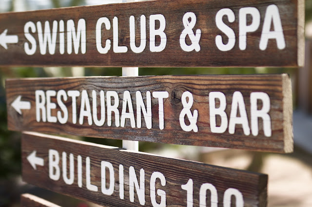 The Ace Hotel & Swim Club wooden direction signs
