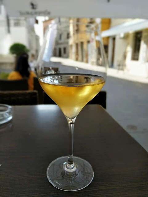 Glass of white wine at Manzioli wine bar in Izola Slovenia