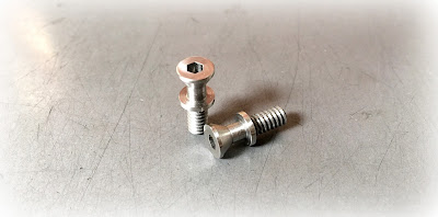 custom machined flat head screws with a stop collar in 303 stainless steel material - engineered source is a supplier and distributor of custom machined screws in stainless steel material