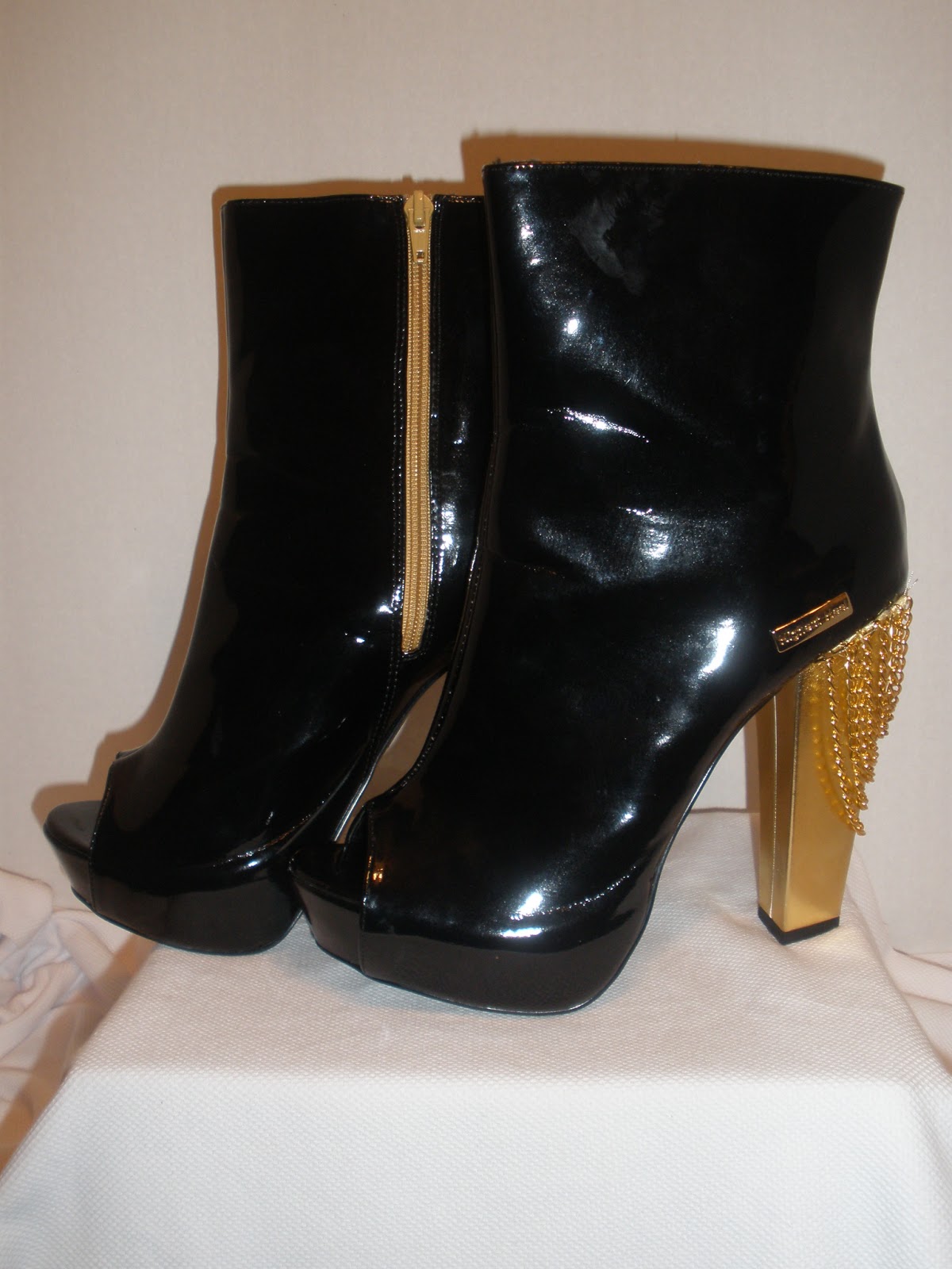 black and gold high heel boots