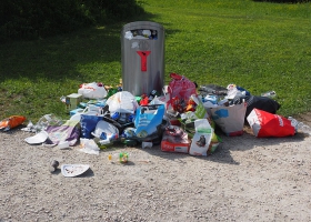Garbage can full of disposable products. Garbage can full of disposable products.