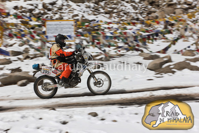 After extreme action of cars at Raid de Himalaya, it's time to have a PHOTO JOURNEY of Bikers. Usually bikes are more interesting to click as compared to cars, but in Raid everything is super exciting !!! Let's start this journey with bikes in action....This whole event is very well planned and everyone is well aware of actions to be happen during the week of Raid. I was really amazed to see the detailing of event at http://www.raid-de-himalaya.com/2011/Xtreme/supregs2w2011.pdf . I have seen documents of other motorsports in North India and most of them are really disorganized and planned very unprofessionally. The whole team of Himalayan Motorsports work really hard to make each thing very special and safe !!!Bikes are really specially for shooting and panning is one of the technique, which can't be missed during such events where bikers love to fly in air...Raid de Himalaya started from Peterhoff Hotel, Shimla and day one ended at Manali through Jalori Pass !!! Whole route was like  Shimla to Manali == Manali-Leh(via Sarchu) ==Leh-Leh(via Wari La & Khardung La) == Leh-Rangdum(via Kargil) == Rangdum-Rangdum(via Padum) == Rangdum-Srinagar(via Kargil)Himalayan Motorsports organize this wonderful event and here are some contact details -Himalayan MotorsportMotoworld, Navbahar, Shimla,Himachal Pradesh - IndiaPhone: +91 (0) 177 2842916Fax: +91 (0) 177 2844338Email: info@raid-de-himalaya.comTotal distance covered was 2200 kilometers, including 667 kilometers of competitive sections. 667 Kms were covered during 11 different competitive stages. The Moto Alpine was about running the first 3 legs of the rally and end at night haltof leg 3 at Leh. This shorter version was open to all newcomers to the Raid de HimalayaOnly those that had never participated before in the Raid (on a / Quad) are eligible tenter for the Moto Alpine.The Moto Xtreme was complete version of the Raid de Himalaya, running all 6 legs anwas open to both previous participants as well as the new entrants to the Raid, In shorwhereas a previous participant could not enter the Moto Alpine...Bikes of 100cc to 700cc participate in Raid and all of them are categorized into different classes, on the basis of their machine powers.Most of these folks used some imported bikes or modified versions of high power bikes. On top of that each biker needs to have a team to ensure that any break-down on the way can be fixed as quick as possible.Another special thing about these motorsport rallies is their route. Most difficult terrain are chosen with appropriate safely measures in mind. In fact, security planning takes various months to finalize things with Government and private agencies. All riders in Raid are really disciplined about safely as well. Following passion with proper safely measures is also very important.Raid de Himalaya rally passes through various villages in Himachal Pradesh and Jammu & Kashmir !!!Riding on such a road is a real luxury. At various points it's difficult to find the road on rough hills with landslides and water streams around !!! Riding bike in Raid is really difficult as riders have no option of driving the vehicles by sitting on closed cabins. Weather is another challenge for bike riders in Raid de HimalayaSome information picked from official Facebook page of RAID DE HIMALAYA Raid de Himalaya is among the most extreme motor sport events organized at an international level. It runs on the highest altitudes as compared to others including the Paris Dakar Rally. http://www.raid-de-himalaya.com/Mountains and Bikes seem to be made to be seen together. Several Indian travellers have now started taking on the mountains on their bikes. The main reason is the same as the the bikers participating in the rally - the thrill of scaling these heights.Navigating the curves, dodging the rocks, and leaving a dust trail, the riders manoever their mean machines faultlessly and spectators can't do much but stare at them with awe.They look the same at a glance, but all riders have their own unique techniques that only experts can detect.Amongst the barren, brown hills the only streaks of colour are these motorbikes. For the duration of the rally, the region comes alive with these dashing, roaring machines.In spite of the tiring route that not only makes you push the boundaries of your schools, each biker starts longing to return for another ride, another adventure soon after one is over.Rearing and roaring like a wild beast, these bikes are merely pets in their riders' hands, obeying each command, following each direction to the last letter.Once the race is over and the bikers have left, the hills lie forlorn, full of longing for these noisy destructive forces of technology to come and make them come alive again.The heights seem scalable and the terrain no longer a foe, when you are flying on your machine. No wonder each biker comes back year after year to scale these heights till they become as familiar to them as the back of their hands. 