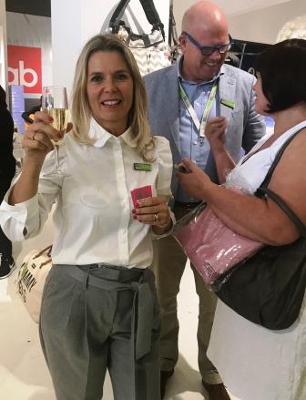 Kids Living Launch Owner of Kids Living with glass of champagne