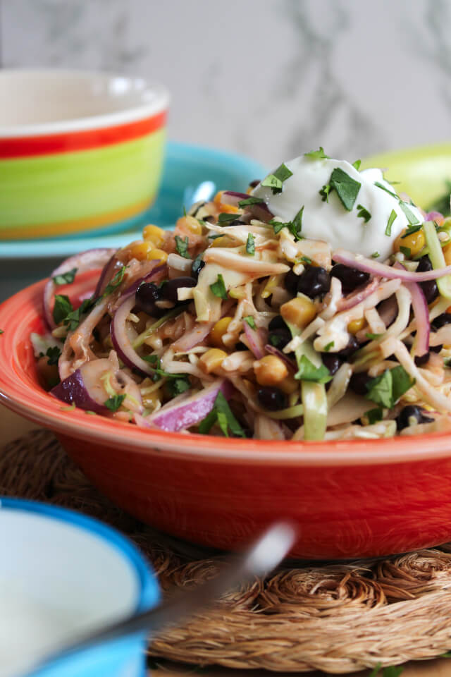 Mexican Slaw is a light and healthy tex-mex twist on traditional coleslaw that is great served as a side dish or as a taco topper!  #feastndevour