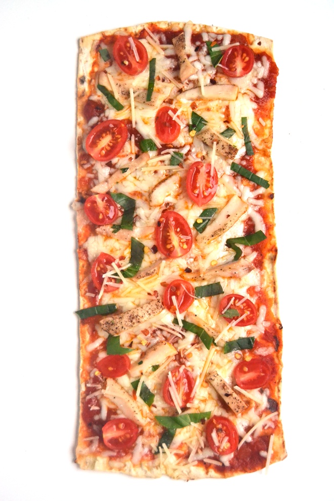 Chicken Parmesan Pizza has all the flavor of your favorite chicken Parmesan on a thin, crispy pizza crust along with fresh basil, tomatoes and melted cheese. The best part: it is ready in just 15 minutes! www.nutritionistreviews.com
