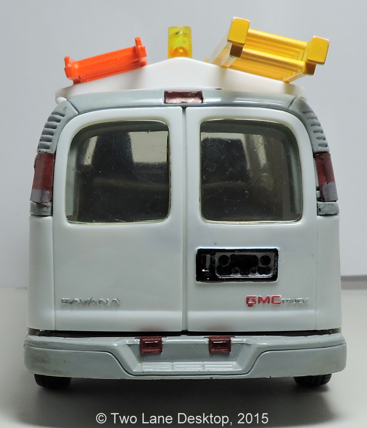 124 GMC Savana work van, Brookfield Chevy Express van, and Johnny Lightning and Maisto Chevy