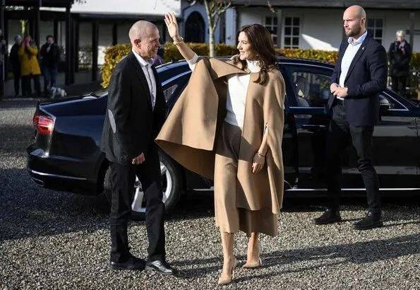 Crown Princess Mary wore Oscar De La Renta camel hair wool-blend cape, CO wool sweater, Naledi Copenhagen clutch