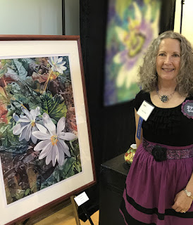 Judy with her watercolor painting Bloodroot in the 2018 Spring Show