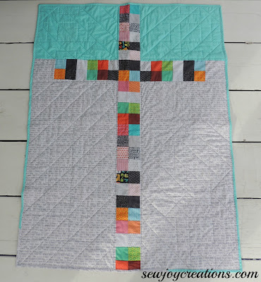 quilt backing cross patchwork design reverse side of baby quilt