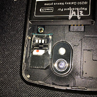the nano-SIM with regular SIM adaptor inside the old phone