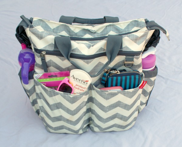 Grey chevron diaper bag by Hop Skip Go. This website shows how to pack the perfect diaper bag for a toddler and includes a free printable checklist so you won't forget any essentials. 
