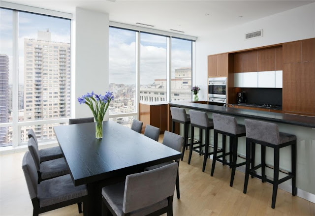 Photo of dinning table and the kitchen in one of the most beautiful penthouses