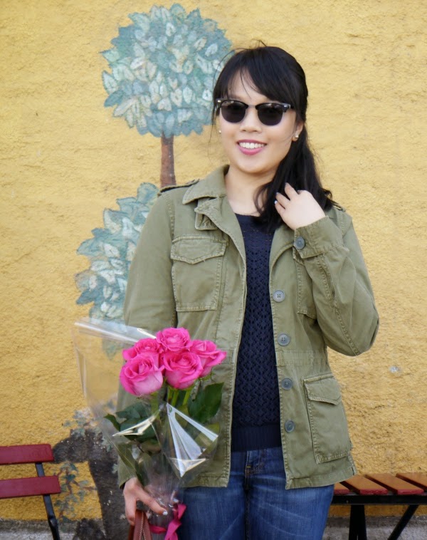 Casual military jacket worn with a navy sweater, boyfriend jeans, Ray-Ban Clubmaster style sunglasses, nude flats, and a large Longchamp Le Pliage grey tote