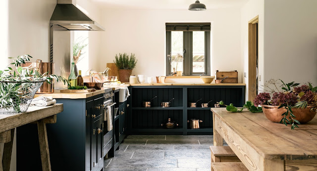 Gorgeous modern country kitchen with dark blue cabinets - found on Hello Lovely Studio