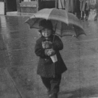 My Mum on Largs seafront after a shower of rain during the 1930s. My Mum on Largs seafront after a shower of rain during the 1930s.