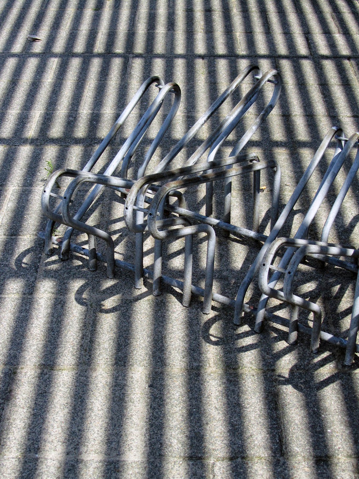 shadows on bicycle rack
