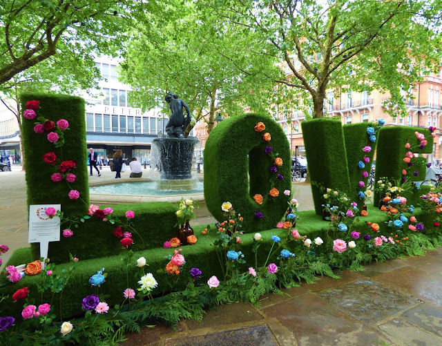 Floral letters in Sloane Square, London, for Chelsea in Bloom 2018 free flower festival