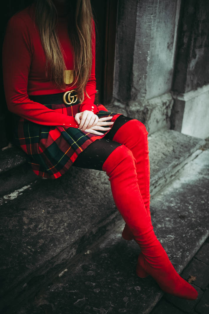 outfit: bright red thigh high boots, plaid skirt, gucci belt