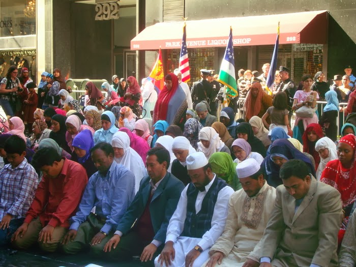 Digging Deeper Through Stories Muslims filling a Street at prayer time