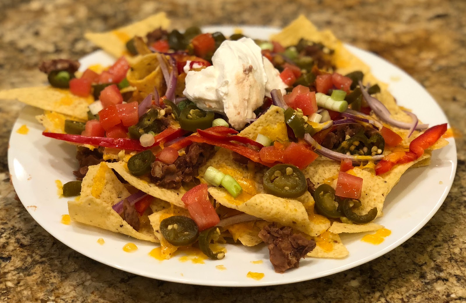 GREAT EATS HAWAII NACHOS WITH REFRIED BEANS AND JALAPENOS