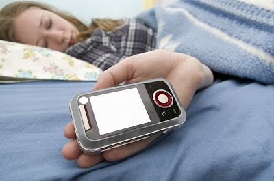 Are your kids awake? They're online Teenager sleeping with her cell phone