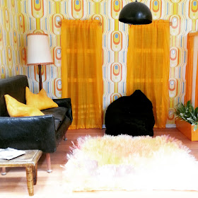 Modern dolls' house miniature 1970s-style lounge.