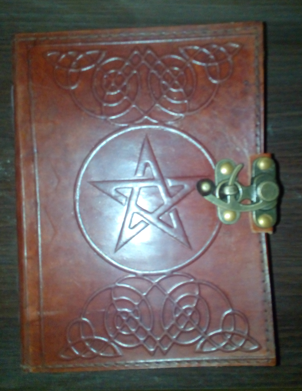 A Wiccan Pentagram Book of Shadows.
