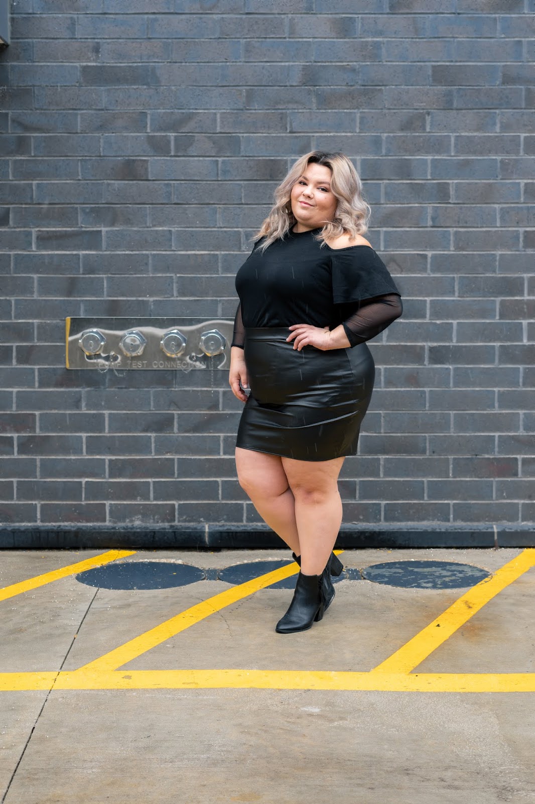 Chicago Plus Size Petite Fashion Blogger, youtuber, and model Natalie Craig, of Natalie in the City, reviews Pink Clove's Daisy Black Halterneck Cold Shoulder Frill Top and Daphne Black PVC Mini Skirt.