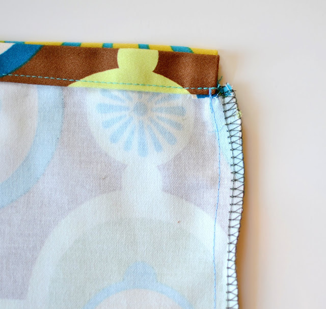 serge the side seams - DIY Drawstring Backpack Tutorial - Blue Susan Makes