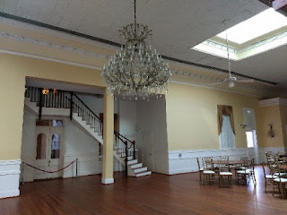 Ashton Villa ballroom ballroom with large crystal chandelier