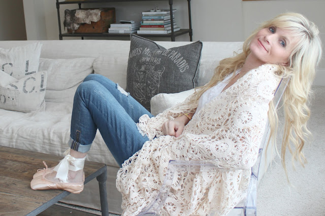 Image of woman relaxing in stylish Belgian style living room - blogger Michele of Hello Lovely Studio