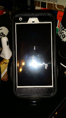 Silver Pixel XL in an Otter Box Defender Case on the Charger Silver Pixel XL in an Otter Box Defender Case, Charging on a Samsung Fast Charger.